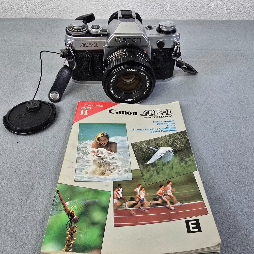 Vintage Canon AE-1 35mm SLR Film Camera with Owner's Manual & Carrying Case